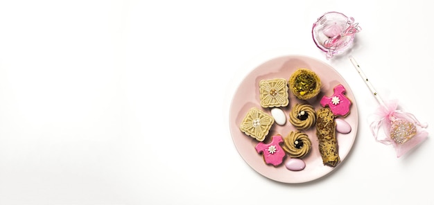 Candy for baby party with candies and cakes on white background. Isolated