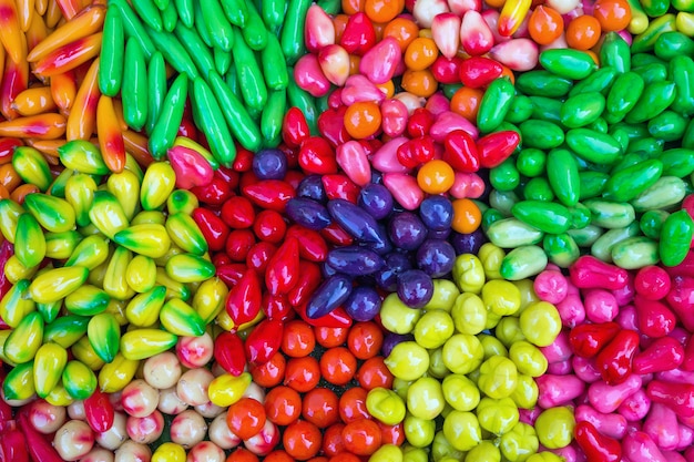 Candy balls plated with colorful Thai dessert.