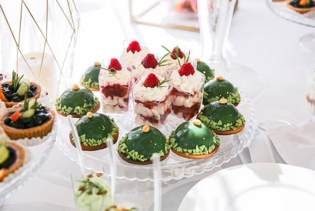 Candy bar at the wedding reception Tasty desserts Beautiful decorations