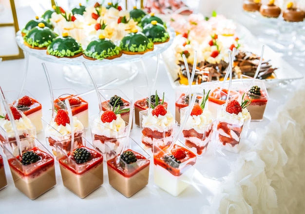 Candy bar at the wedding reception Tasty desserts Beautiful decorations