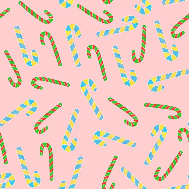 Candy canes seamless pattern on pink background.