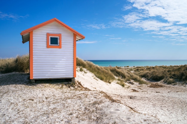 Candy coloured beach hut on Skanor beach in Falsterbo, Skane, Sweden. Swedish tourism concept