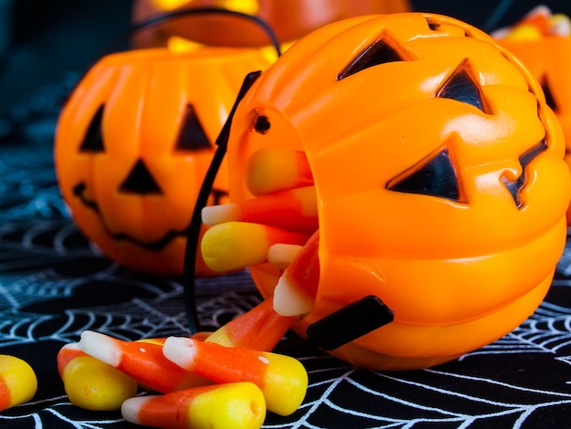 Candy corn candies falling out of Halloween treat bag.