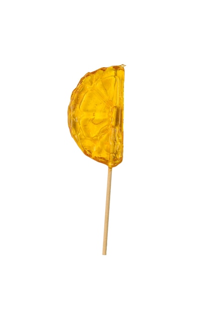 Candy lollipop in the shape of an orange slice isolated on a white background