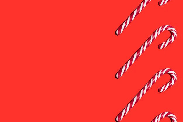 Candy lollipops pattern on a red background happy new year and christmas