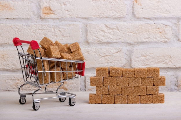 Cane sugar cubes are loaded into a cart