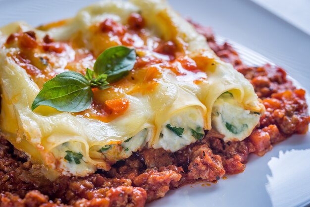 Canelloni stuffed with ricotta with bolognese sauce