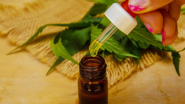 Cannabis essential oil in a small bottle Selective focus