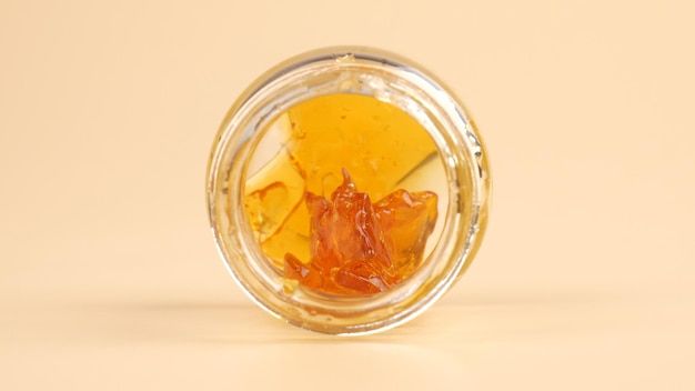 Cannabis extract rosin with high thc in a glass bottle