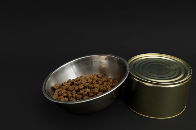 Canned food in a tin on a black background