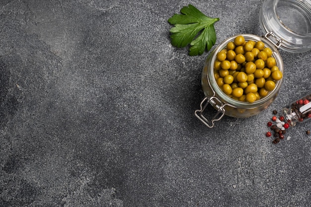 Canned green peas in a glass jar Homemade fermented food copy space