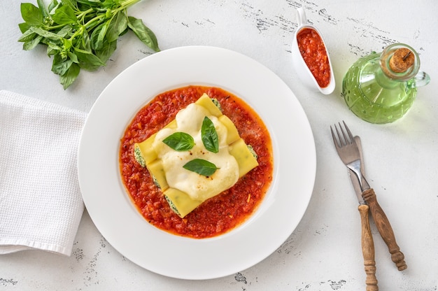 Cannelloni pasta stuffed with ricotta and spinach with tomato sauce