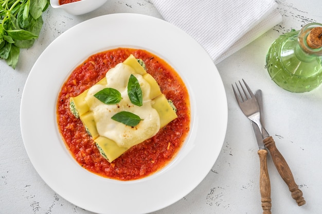 Cannelloni pasta stuffed with ricotta and spinach with tomato sauce