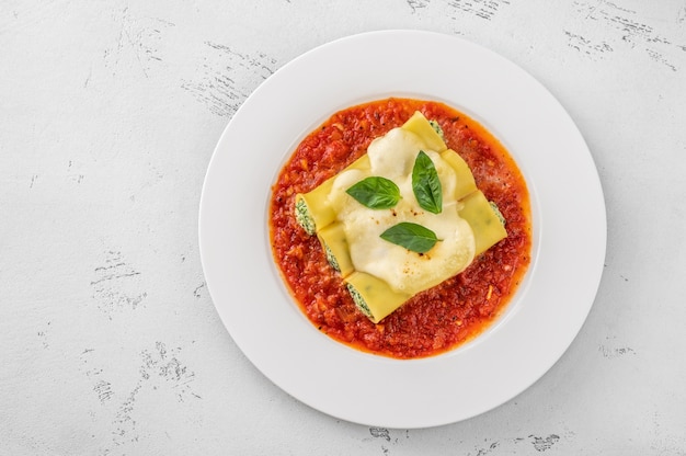 Cannelloni pasta stuffed with ricotta and spinach with tomato sauce