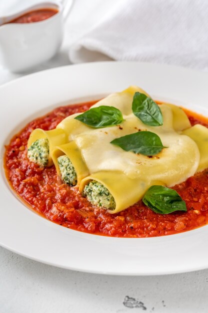 Cannelloni pasta stuffed with ricotta and spinach with tomato sauce