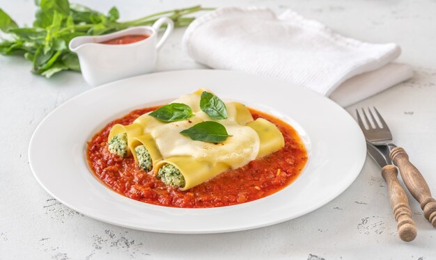 Cannelloni pasta stuffed with ricotta and spinach with tomato sauce