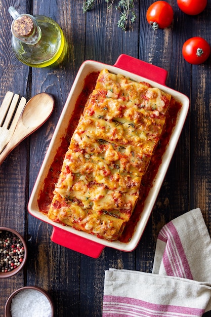 Cannelloni with meat cheese tomatoes and thyme Italian cuisine