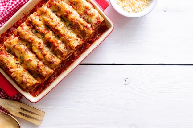 Cannelloni with meat cheese tomatoes and thyme Italian cuisine