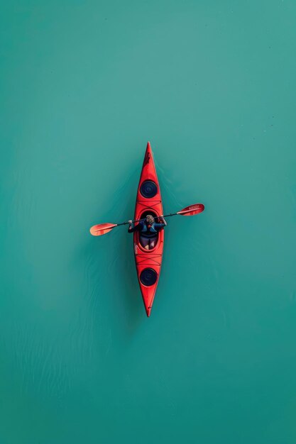 Photo a canoe on a calm lake isolated on a solid teal background emphasizing the peacefulness of the scene