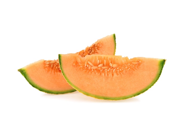 Cantaloupe melon slices on white background