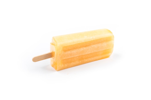 Cantaloupe popsicles placed on a white surface