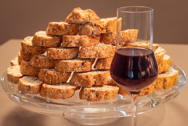 Cantucci e vin santo Traditional Italian almond cookies with sweet wine selective focus