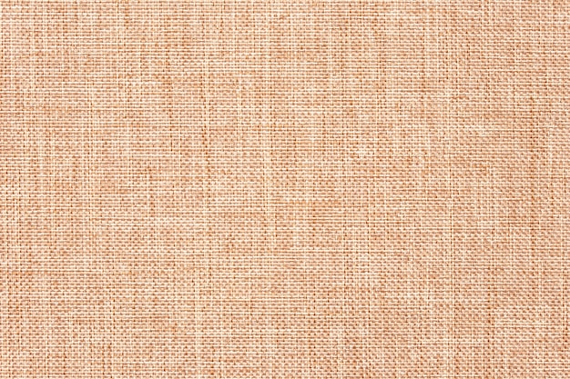 Canvas cloth, burlap, rustic home decor. Natural jute hessian, texture. Abstract light brown textile background.