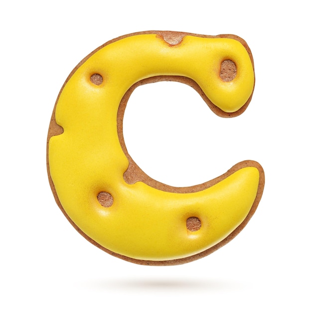 Capital letter C yellow homemade gingerbread biscuit isolated on white background