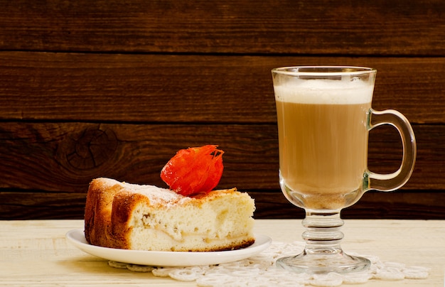 Cappuccino and apple pie on a wooden table