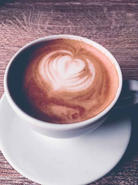 Cappuccino for breakfast in cafeteria coffee cup on table in parisian cafe