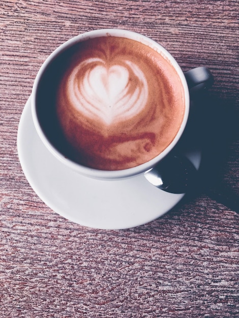 Cappuccino for breakfast in cafeteria coffee cup on table in parisian cafe