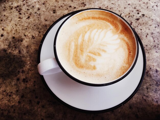 Cappuccino for breakfast in cafeteria coffee cup on table in parisian cafe