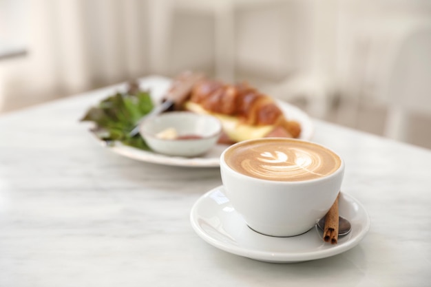 Cappuccino coffee cup on white marble table