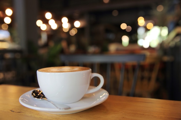 Cappuccino coffee on wood background