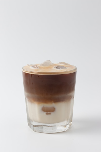 Cappuccino in a glass cup on white background