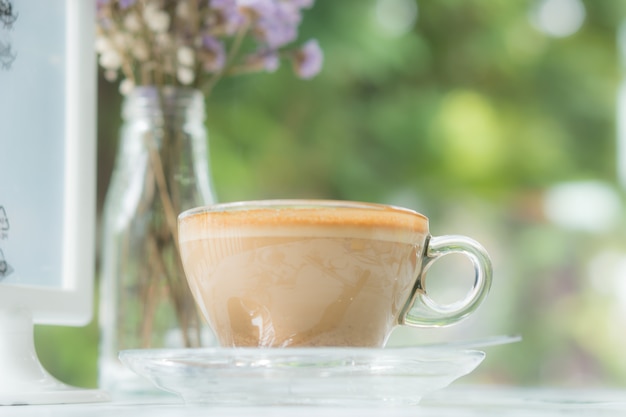 Cappuccinu coffee in clear cup on table cafe