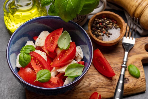 Caprese salad with ripe tomatoes mozzarella and garden basil