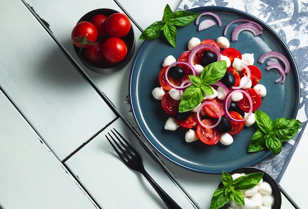 Photo caprese traditional italian vegetable salad with mozzarella cheese on a plate