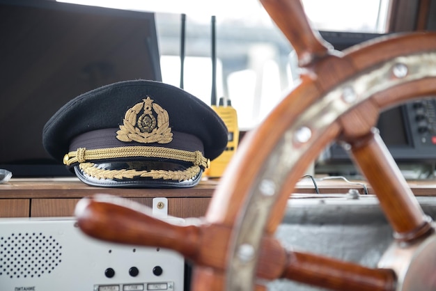 Captain's hat in the control room of the ship