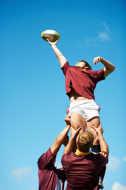 Capturing an epic moment Shot of a young rugby player catching the ball during a lineout