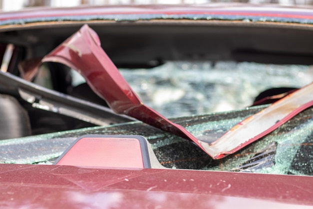 A car after an accident with a broken rear window Broken window in a vehicle with a rear brake light