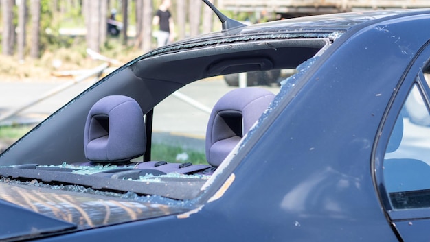 A car after an accident with a broken rear window Broken window in a vehicle The wreckage