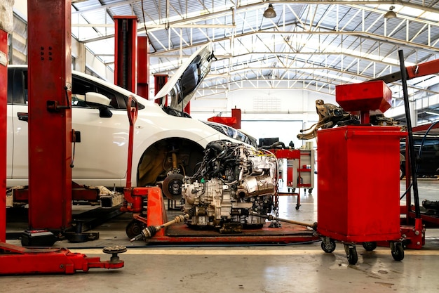 Car in automobile repair service center with softfocus and over light in the background