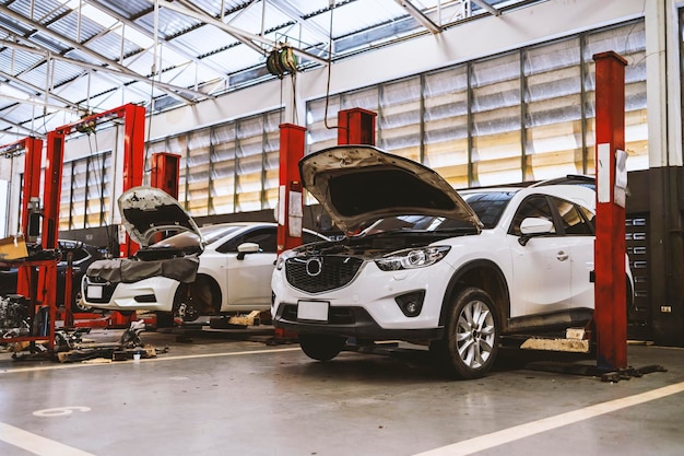 Car in automobile repair service center with softfocus and over light in the background