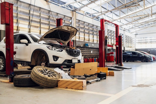 Car in automobile repair service center with softfocus and over light in the background