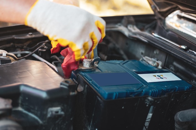 Car battery repair and replacement The mechanic is servicing the car