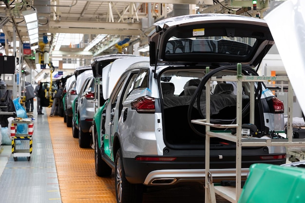 Car bodies are on assembly line factory for production of cars modern automotive industry electric