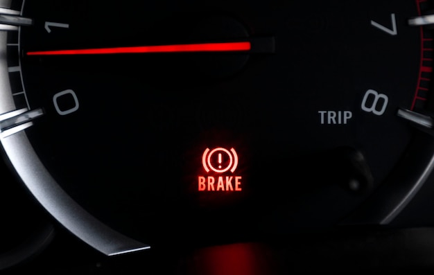 Car dashboard show status light icon BRAKE and steering wheel