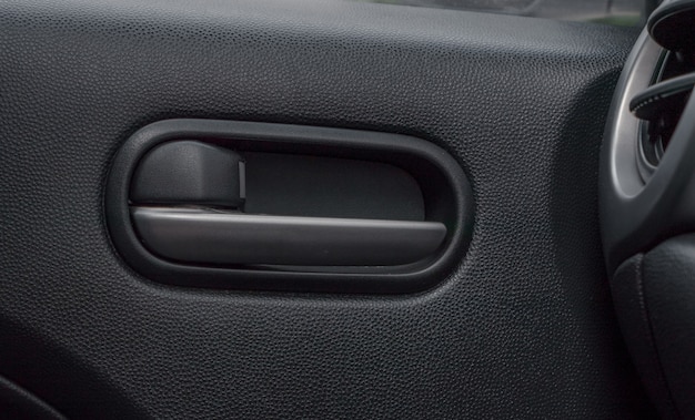 Car door lock lever inside driver place.