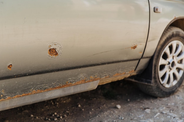 Car door with rust and metal corrosion Need repairs road salt damage